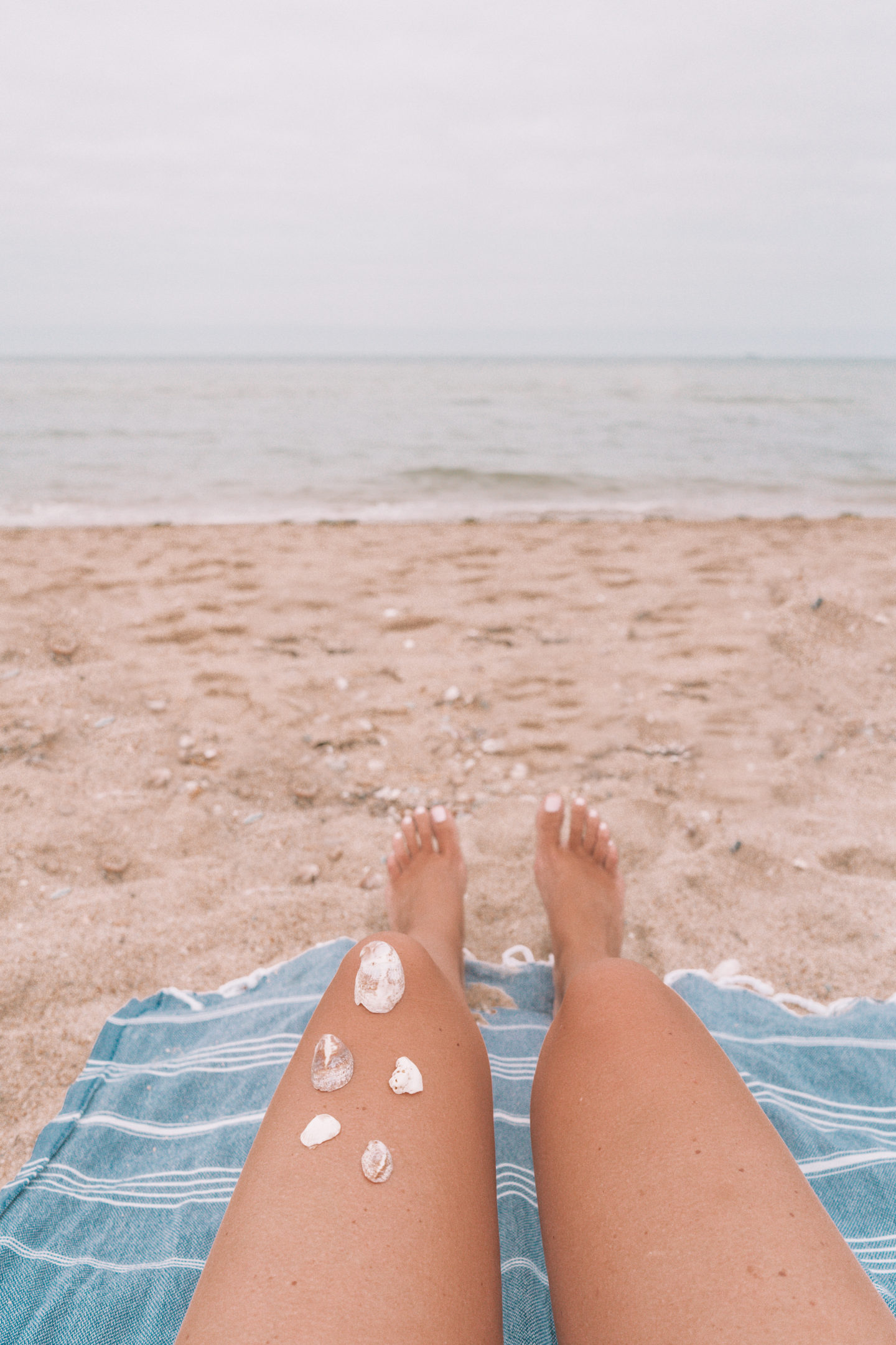 woman's legs on the beach in Nantucket